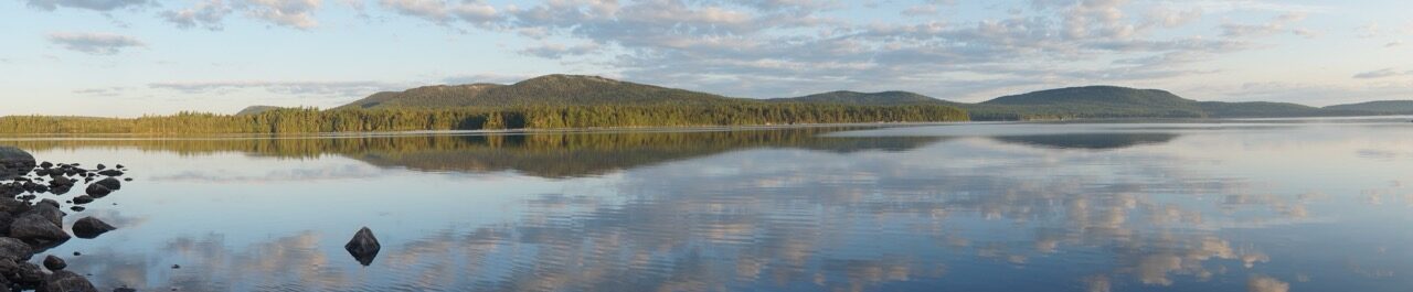 Panorama of calm lake and hills